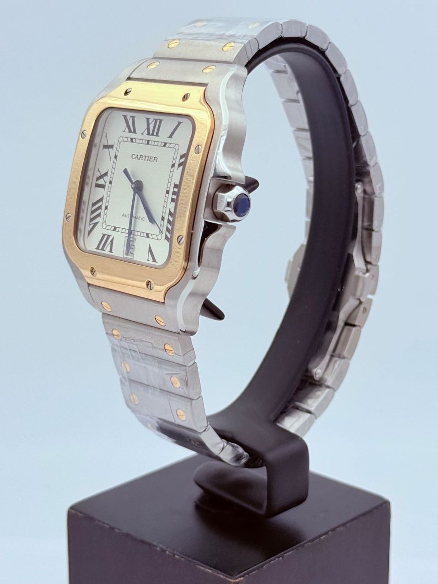 Orologio Santos de Cartier, modello grande, movimento automatico, oro giallo, acciaio, bracciali intercambiabili in metallo e pelle