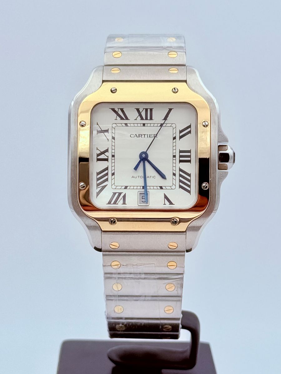Orologio Santos de Cartier, modello grande, movimento automatico, oro giallo, acciaio, bracciali intercambiabili in metallo e pelle